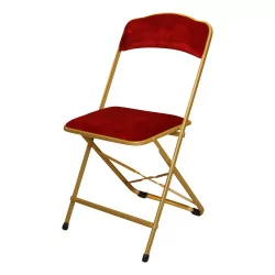 Складной стул из окрашенного в золотой цвет металла с сиденьем и спинкой из …