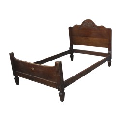 A richly carved walnut bed frame on the headboard, marquetry star to be renovated.