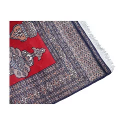 Tapis d'orient coloris rouge avec franges blanches. 20ème …