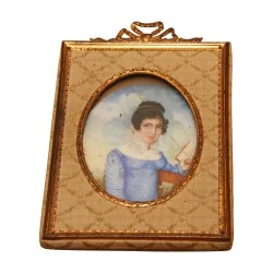 Medallion “Young woman” with fabric and brass frame, decoration …
