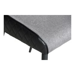 把 Darling 椅子，配有黑色钻石靠背和灰色织物前面板。