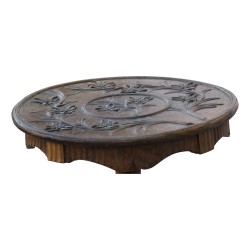 Brienz wooden pedestal table with carved decoration on …