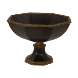 Empty pocket bowl in black painted porcelain with bronze finish.