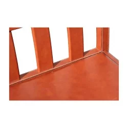 large brown leather bench seat with topstitching...