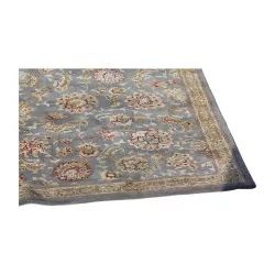 Tapis composé de 80% de laine et 20% de nylon, coloris bleu