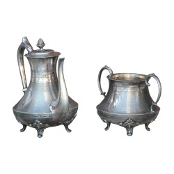 套银质茶具，包括 1 个茶壶和一个糖罐……
