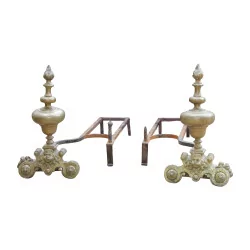Pair of Louis XIV patinated bronze andirons. France, late 18th...