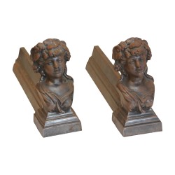 Pair of female face andirons in cast iron. 20th century