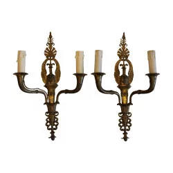 Pair of Empire sconces in chased bronze with 2 lights. Beginning …