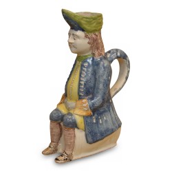 Pichet dit «jacquot» à décor polychrome en forme d'homme assis …