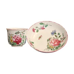 earthenware cup and saucer with polychrome decoration of flowers...