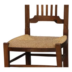 Stillstuhl aus Nussbaumholz und Sitzfläche aus Stroh. Schweizerisch, …