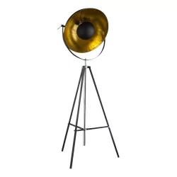 black floor lamp on three legs, the shade is rotating and golden