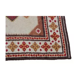Rectangular rug in brown, white, yellow and red without …