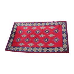 Rectangular rug in red, yellow, blue and brown without …