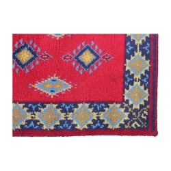 Rectangular rug in red, yellow, blue and brown without …