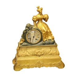 Gilded and black bronze woman's clock with key. 20th century