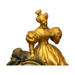 Pendule Femme en bronze doré et noir avec clé. 20ème siècle