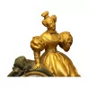 Pendule Femme en bronze doré et noir avec clé. 20ème siècle - Moinat - Pendules à poser