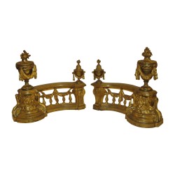 Pair of Louis XVI andirons in chased and gilded bronze. 19th …