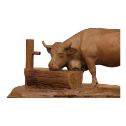 Walnut cow at a drinking trough, sculpture by Brienz, installed …
