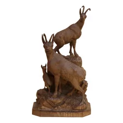Group of chamois on the rocks, in carved wood from Brienz. …