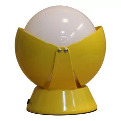 vintage yellow lamp, in the shape of a sphere with sheet metal cover …