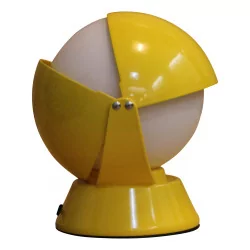 vintage yellow lamp, in the shape of a sphere with sheet metal cover …