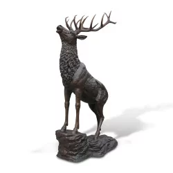 Stag that roars in brown patinated bronze, life-size on its …