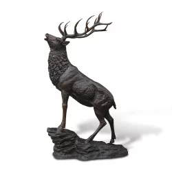 Stag that roars in brown patinated bronze, life-size on its …