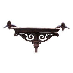 Birdbath with two birds on each side.