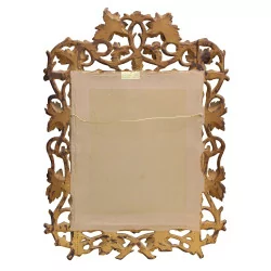 Miroir sculpté en bois avec une touche de doré, de Brienz. …