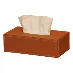 Un boite à mouchoirs rectangulaire en cuir beige
