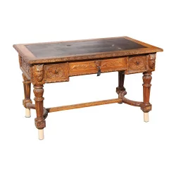 Henri II table in richly carved oak. Tray with leather …