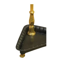 Golden umbrella stand with black base.