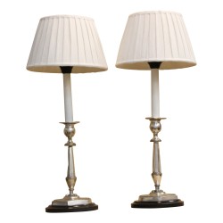 Pair of silver candlesticks transformed into a lamp. Lampshade in …