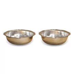 Pair of hollow silver metal dishes.