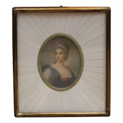 Miniature de femme avec cadre ivoirine et laiton.