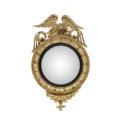 Regency period eagle mirror in carved and gilded wood, mirror …