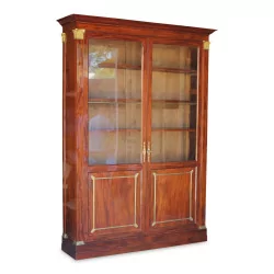 Large Empire showcase in mahogany mounted on oak. Glass in …