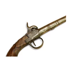 Pistol with carved wooden butt and guilloché breech.