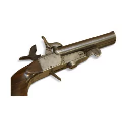 Miniature pistol with walnut stock and double steel barrel.