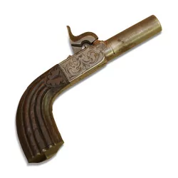 Pistol with engine-turned breech and barrel, walnut stock...