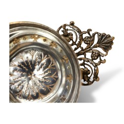 Decorated metal tea strainer.