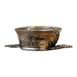 Decorated metal tea strainer.