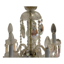 Small iridescent crystal chandelier with glass sheaths.