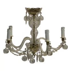 Small crystal chandelier with glass sheaths.