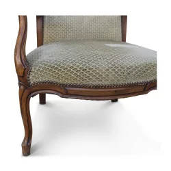 Voltaire armchair in walnut covered with beige patterned fabric. …