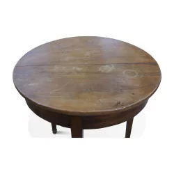 Directoire round table in walnut with 3 spindle legs. Switzerland Vaud,
