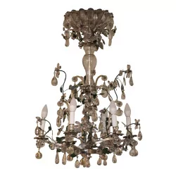 Chandelier in silvered bronze and green wrought iron with flower crystals.
